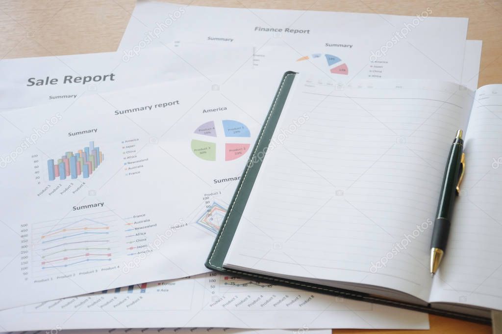 Close up notebook with summary report. Concept of Data Analysis Investment Planning Business Analytics