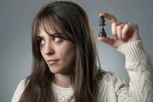 Bored Woman with Chess Piece — Stock Photo, Image