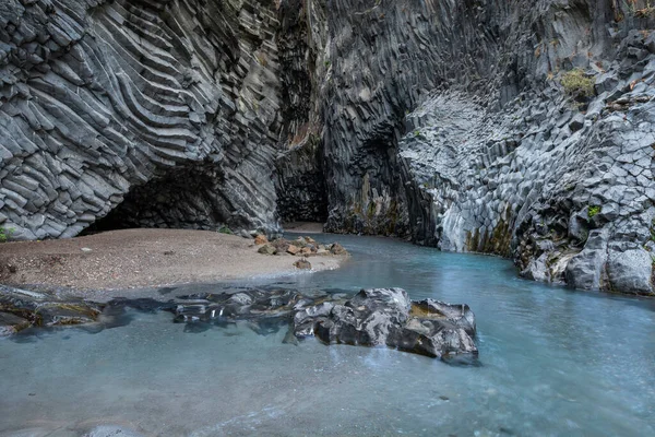 Gole dell Alcantara gorge with river Alcantara close to Taormina, turquoise water and basalt lava cliffs, Sicily Italy