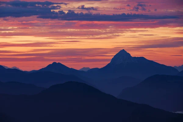 Mountain silhouettes layers of the Bavarian Alps during sunrise from Jochberg Walchensee, Bavaria Germany