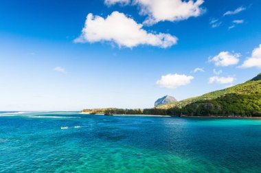 Beautiful seascape with a mountain of Le Morne Brabant in the background. Mauritius Island clipart