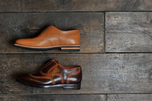 leather handmade shoes on a wooden background