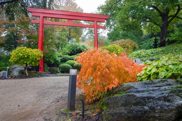 Red  Gates into Japanese garden in  Kaiserslautern  Germany. Magical  falling !