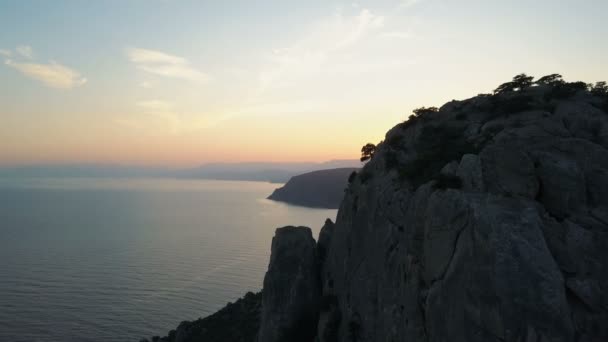 Aerial view of sunset over beautiful Black sea and mountains on a sunset sky background — Stock Video