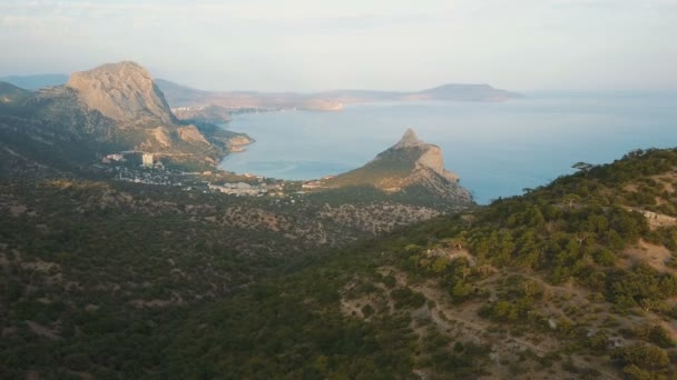 Aerial shot of amazing mountains and rocks on a seashore. Karaul-oba Mountain in Crimea. — Stock Video