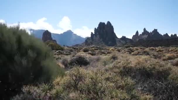 Beautiful mountain scenery of Teide National Park on Tenerife, Canary Islands. View on a rocky volcanic desert and huge Crater of Teide volcano. Fast motion of camera, side view. — Stock Video