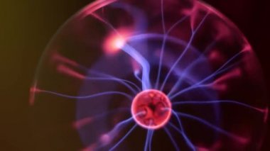 Plasma ball lightning, Tesla lamp, Plasma globe with high voltage lightning. Coil experiment with electricity. Discharge lamp. Inert gas discharge tube. hameleon effect changing color