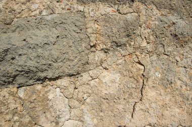 Ceneviz Kalesi duvar parçası. Eski stonewall. Dokulu arka plan. Taş ve beton. 