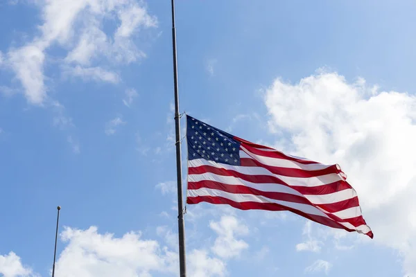 United States flag flying at a half-staff