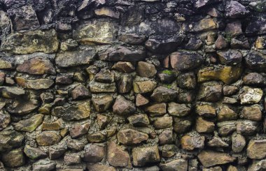 Arka plan veya doku duvar duvar çimento ile inşa edilmiş eski taş desen