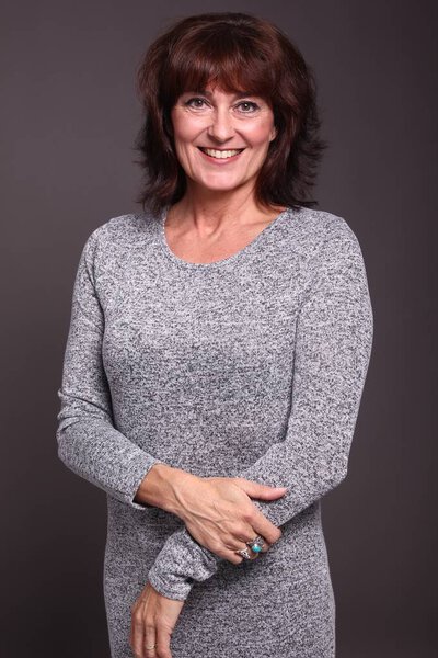 Beautiful happy woman in front of a white background