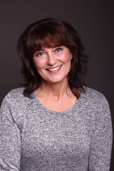 Beautiful happy woman in front of a white background