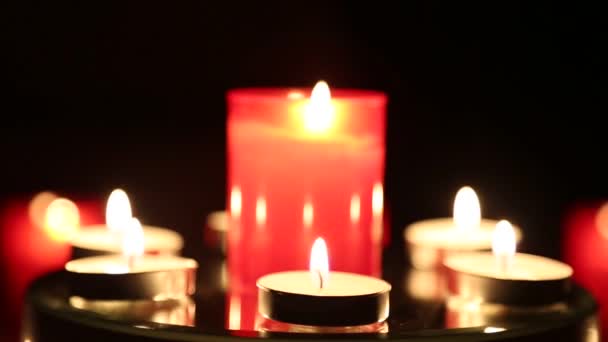 Red Candles Burning Shimmering Dark — Stock Video