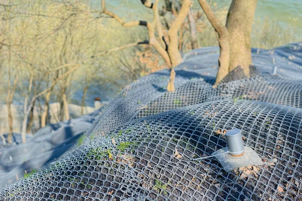 Mountain slope reinforced metal mesh — Stock Photo, Image