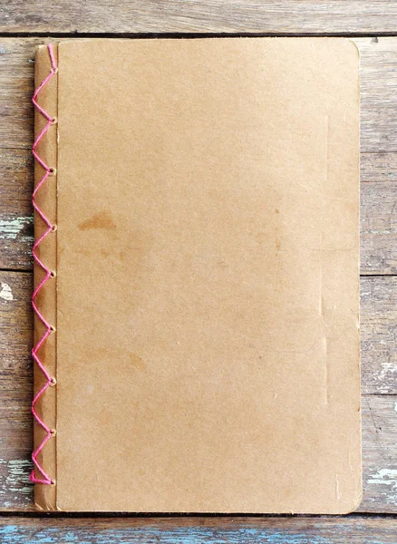 Blank brown cover book on wood — Stock Photo, Image