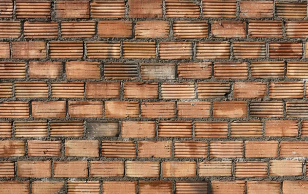 Struktur der orangefarbenen Ziegelwand — Stockfoto