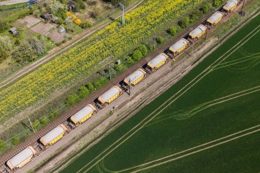Aerial view of the train on the railway track clipart