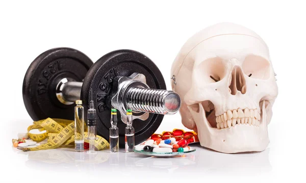 Metal dumbbell with drugs — Stock Photo, Image