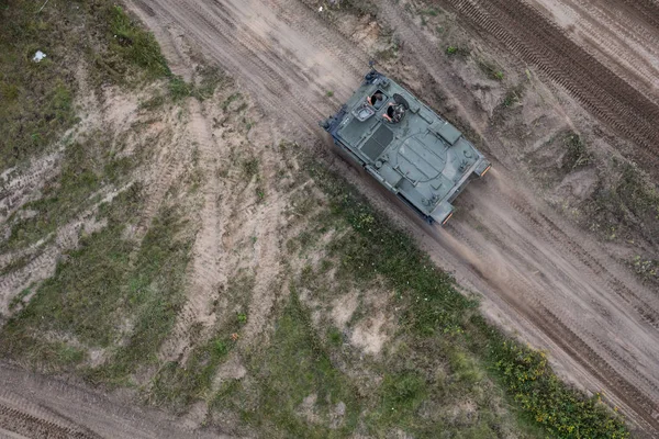 Aerial view of the military transporter on the military training ground — Stock Photo, Image