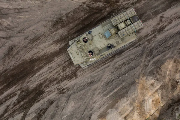 Aerial view of the military transporter on the military training ground — Stock Photo, Image