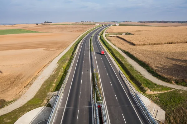 Car going by modern highway — Stock Photo, Image