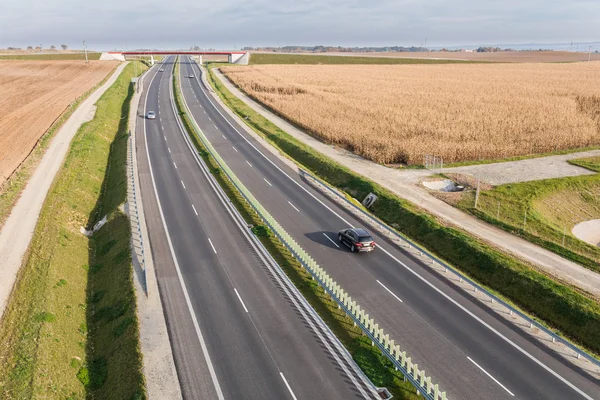 Cars going by modern highway — Stock Photo, Image