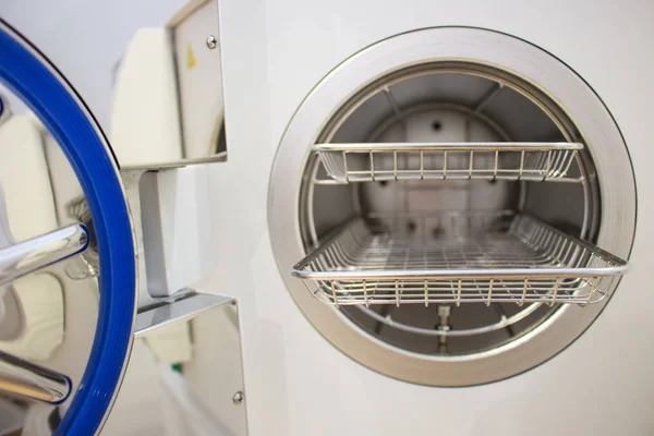 Sterilizing medical instruments in autoclave. Equipment for sterile cleaning of working medical instruments