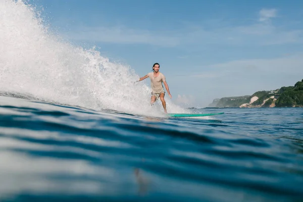 Side View Young Man Wet Shirt Riding Waves Surfboard While — Stock Photo, Image