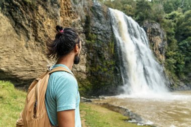 tourist near waterfall clipart