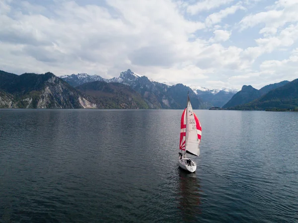 lonely boat on the beautiful lake Traunsee in austria, sailing boat, alone on the water