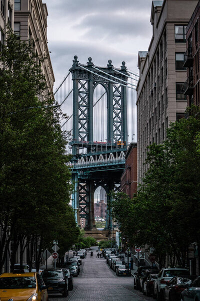View of one of the towers of the Manhattan Bridge from the streets of the DUMBO district, Brooklyn, NYC