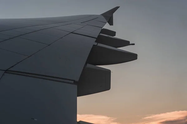 Airplane wing through the airplane window — 스톡 사진