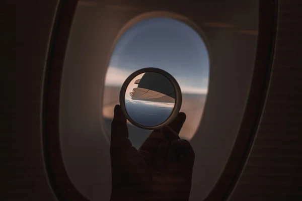 Looking outside an airplane window — Stok fotoğraf