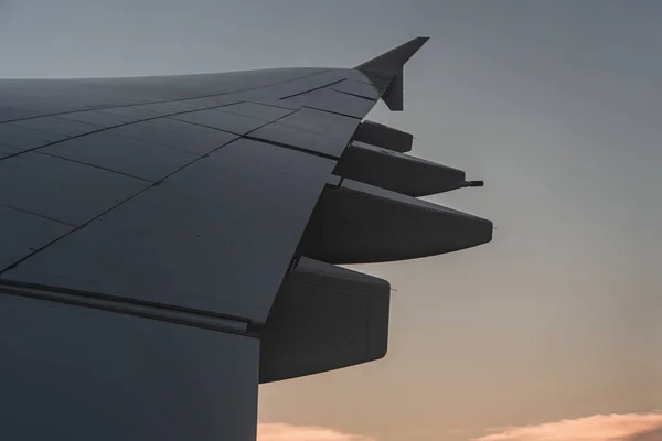 Airplane wing through the airplane window — 스톡 사진