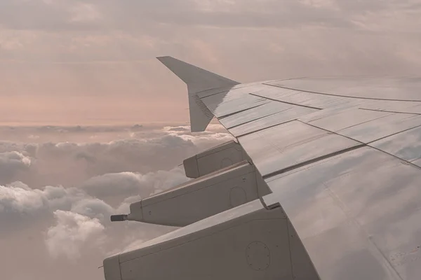 Airplane wing through the airplane window — 스톡 사진