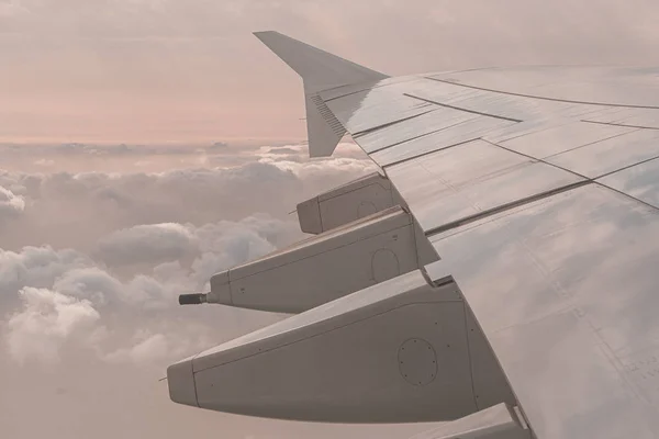 Airplane wing through the airplane window — 스톡 사진