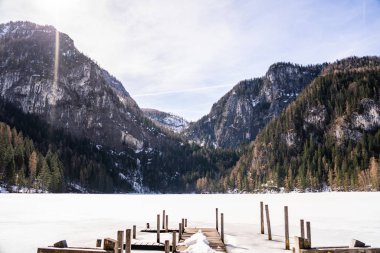 gleinkerlake during winter in the heart of the austrian alps. frozen lake in front of some huge mountains