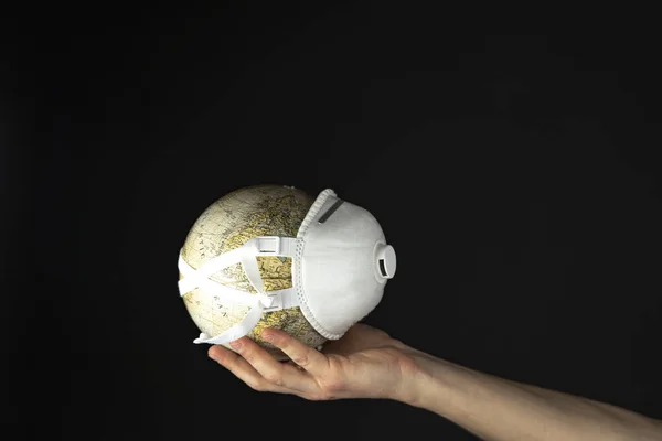 world Corona virus attack concept. world/earth put mask to fight against Corona virus. Concept of fight against virus, danger and public health risk disease.Many Virus attack