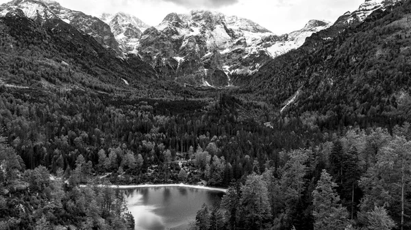 Austrian Alps black and white image, lake in austria with mountains in the background