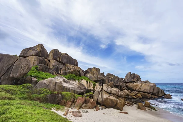 Rough and wild rocky coastline at anse songe, la digue, seychell — Stock Photo, Image