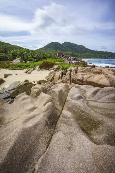 Rough and wild rocky coastline at anse songe, la digue, seychell — Stock Photo, Image