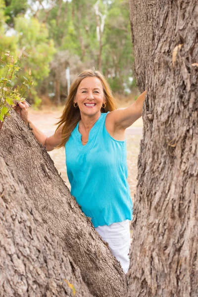 Relaxed friendly senior woman outdoor park — Stock Photo, Image