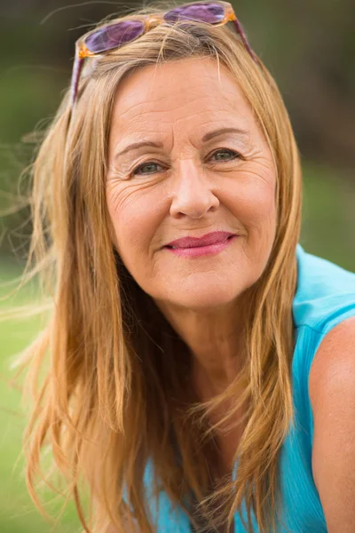 Friendly thoughtful mature woman outdoor — Stock Photo, Image