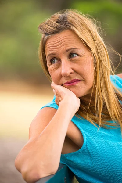 Thoughtful contemplating mature woman — Stock Photo, Image