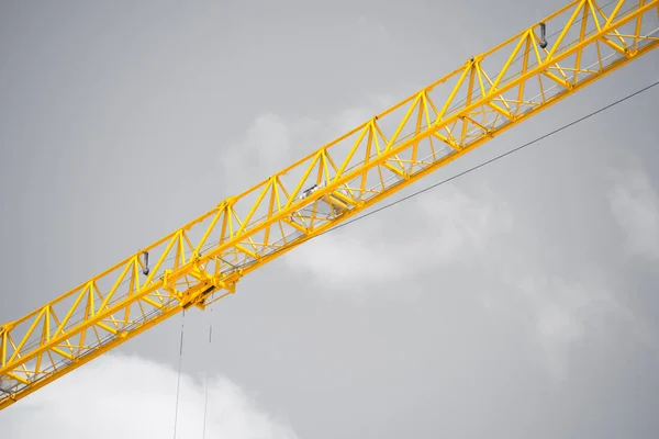 Close up Construction crane grey sky backdrop — Stock Photo, Image