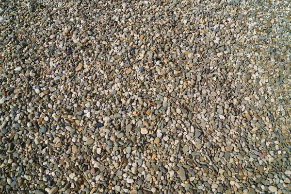 A lot of tiny stones, pebble, gravel, mix of colors — Stock Photo, Image