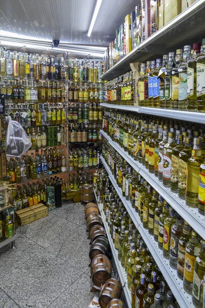 Rows of different types fo cachaca drink, made from distilled ru — Stock Photo, Image