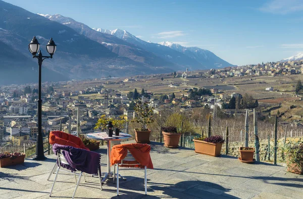 Dining table with a view overlooking Sondrio, Italy — Stock Photo, Image
