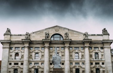 Provocative statue by Maurizio Cattelan entitled L.O.V.E in front of Italian stock exchange in Milan, Lombardy, Italy clipart