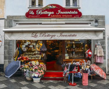 La Bottega Incantada meaning the Enchanted Workshop, a souvenir shop in the Roman town of Aosta in northwestern Italy clipart